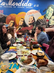 Students at a table in a Mexican restaurant in Madrid.