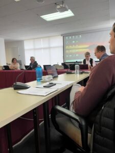 Students and speakers at the table in Madrid