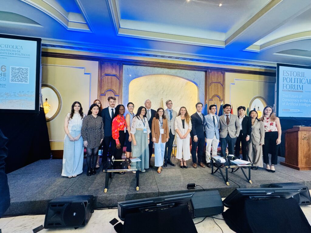 Group of students and staff standing together for a photo at Estoril