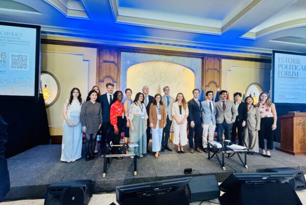 Group of students and staff standing together for a photo at Estoril