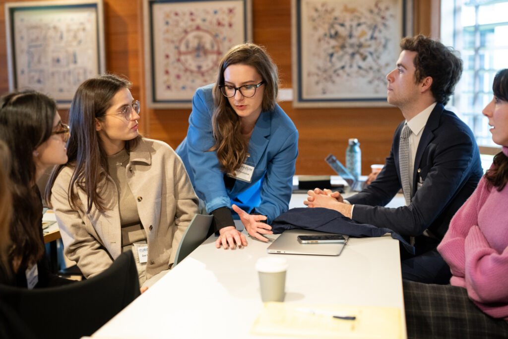 Group of students listening to a student
